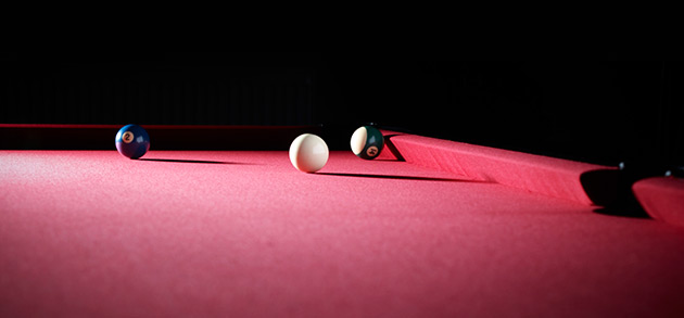 red pool table cloth on table